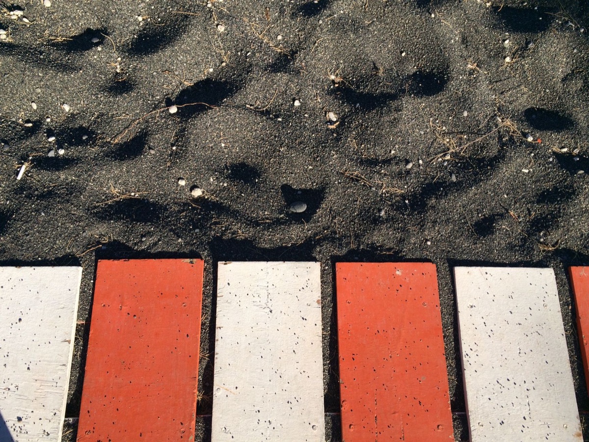 red sand beach with white sand
