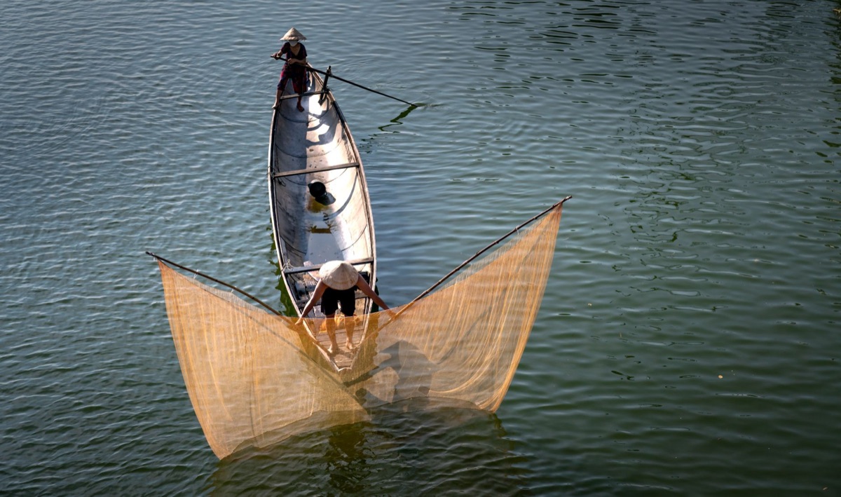 local fisherman with traditional net