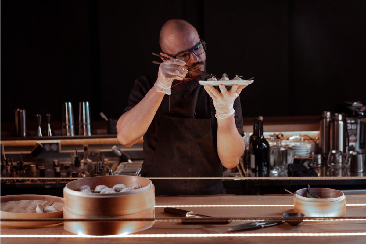 local okinawan chef preparing modern dish