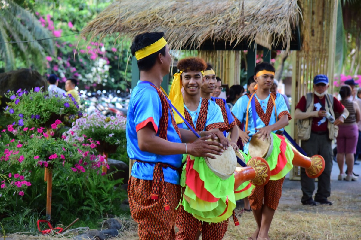 Local community gathering with traditional and modern musicians