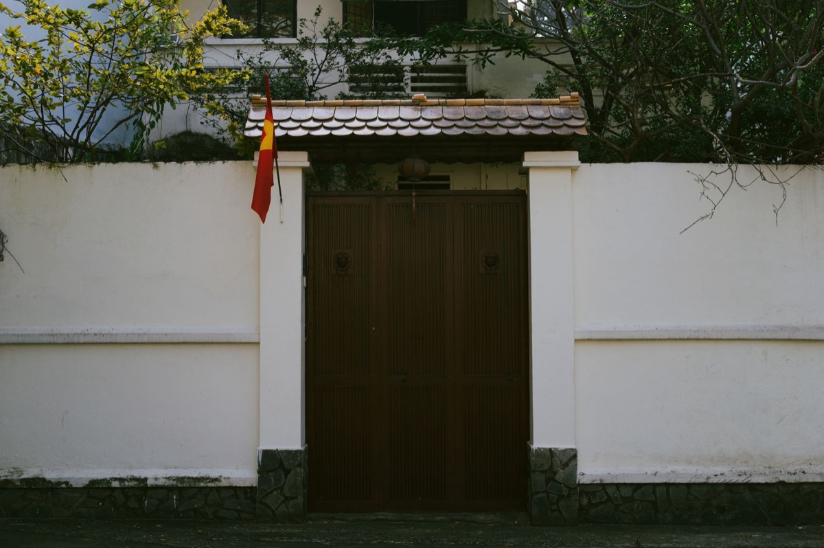 Traditional Okinawa house with white gate at beach shore