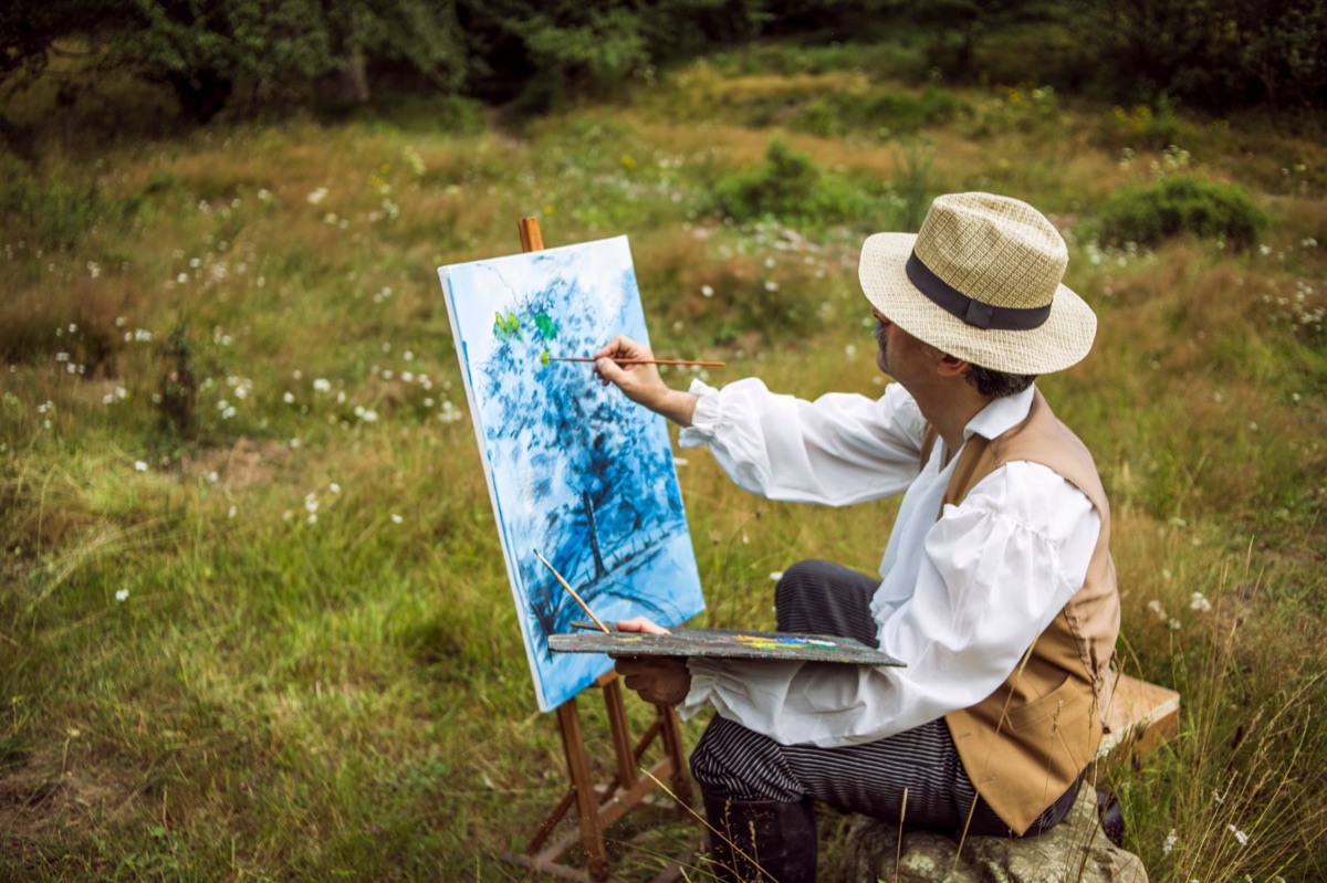 Okinawan artist painting traditional landscape